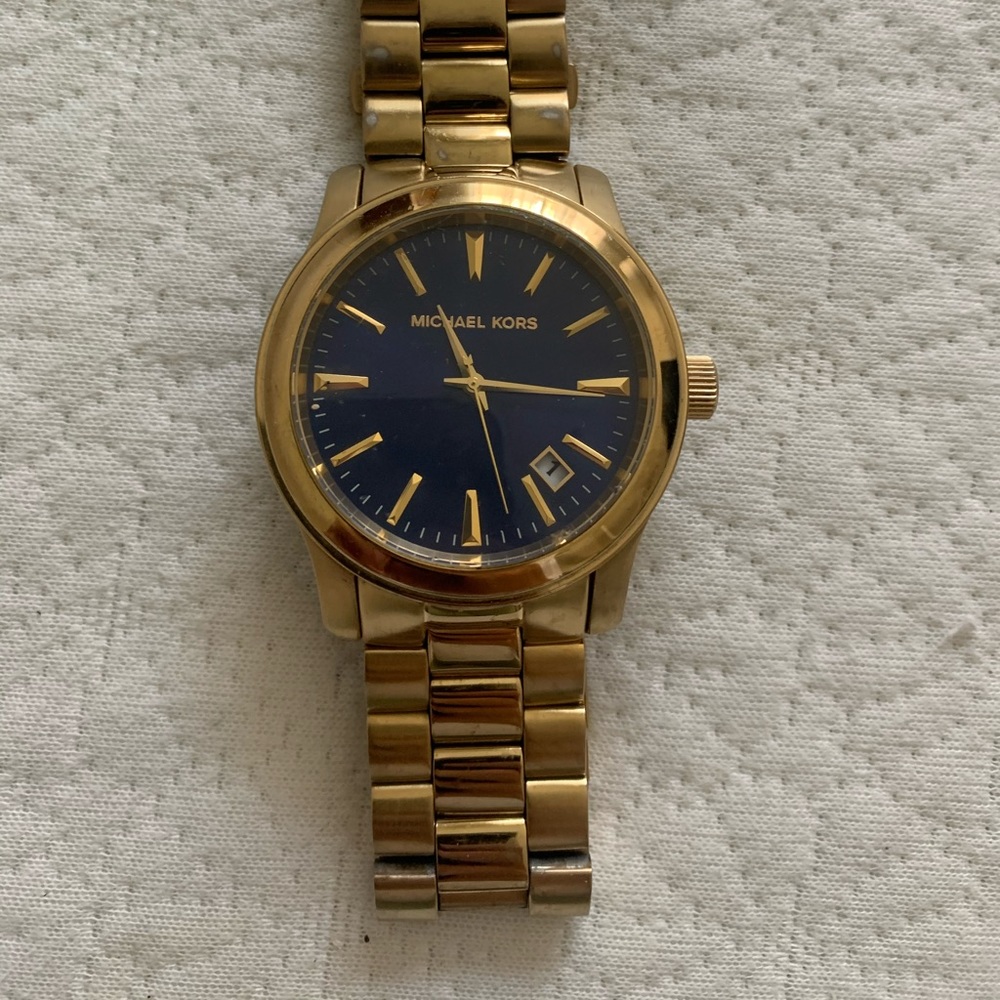 Michael Kors gold and navy blue wrist watch